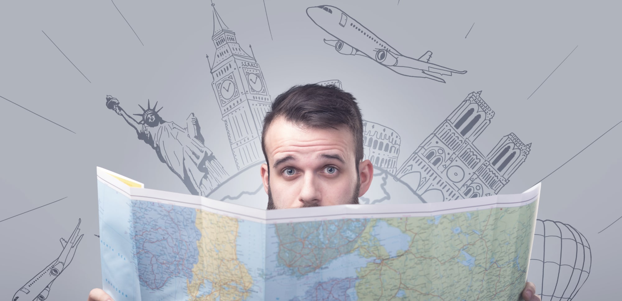 Man holding a map with famous sightseeing destinations