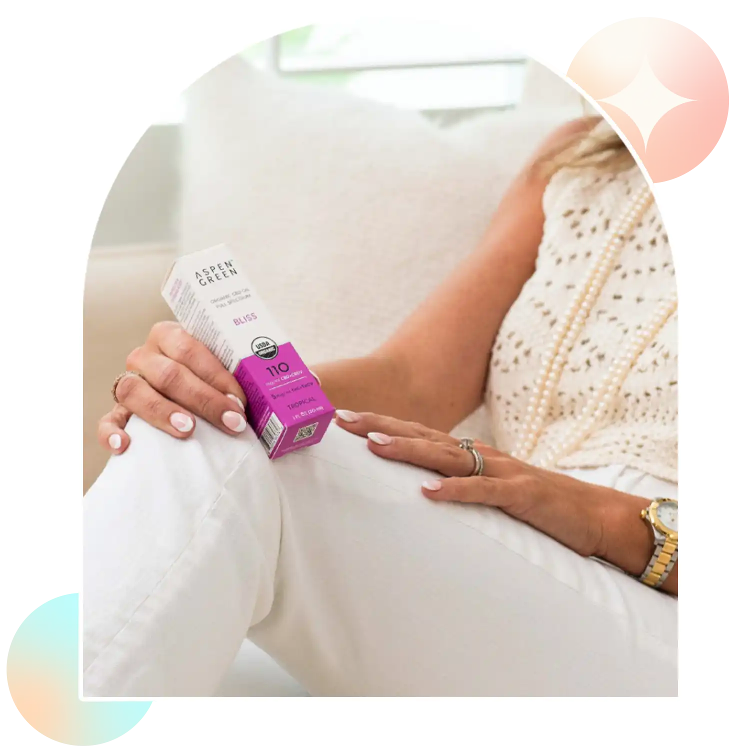 Woman holding Aspen Green Bliss CBD Oil box
