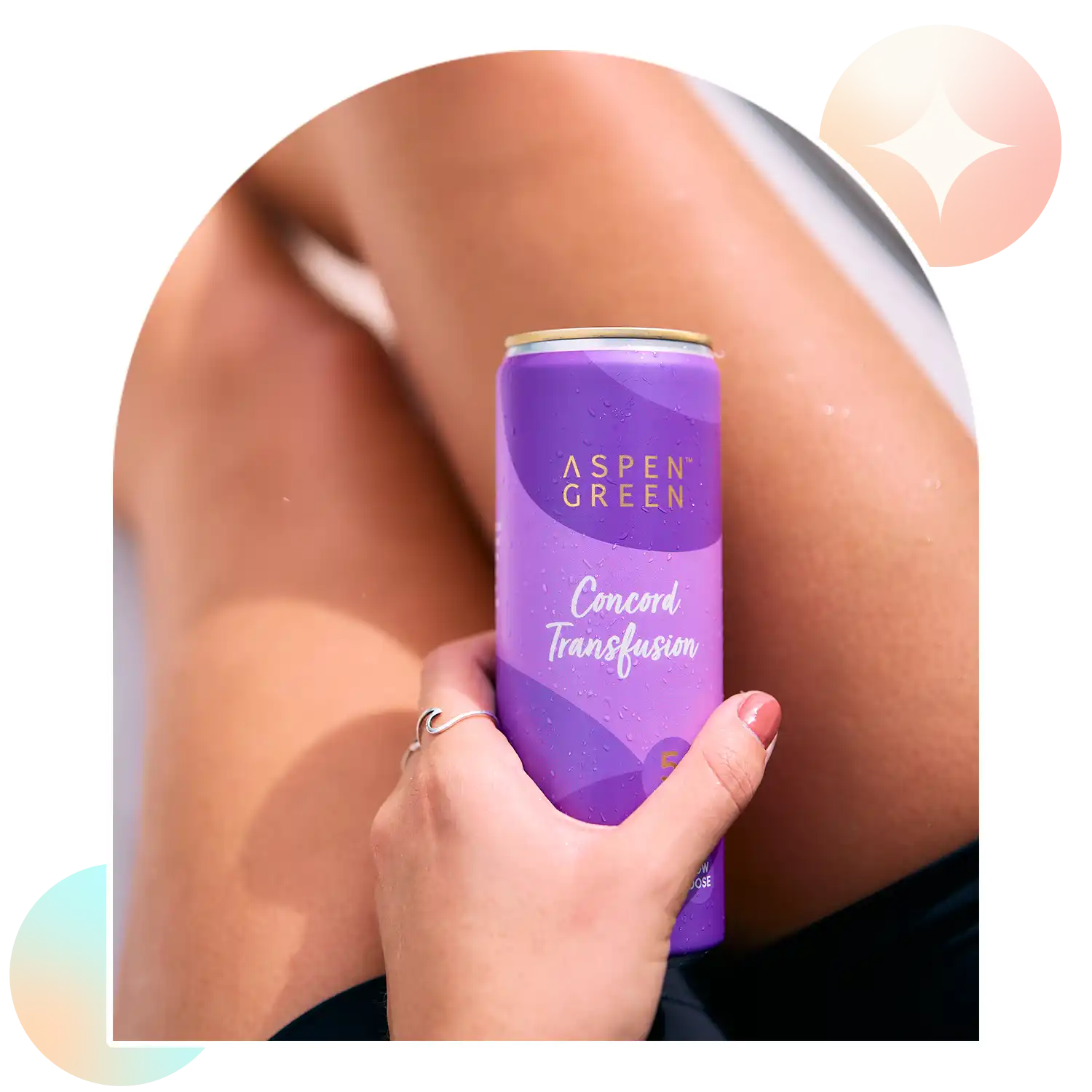 Hand holding refreshing Aspen Green Concord Transfusion THC drink