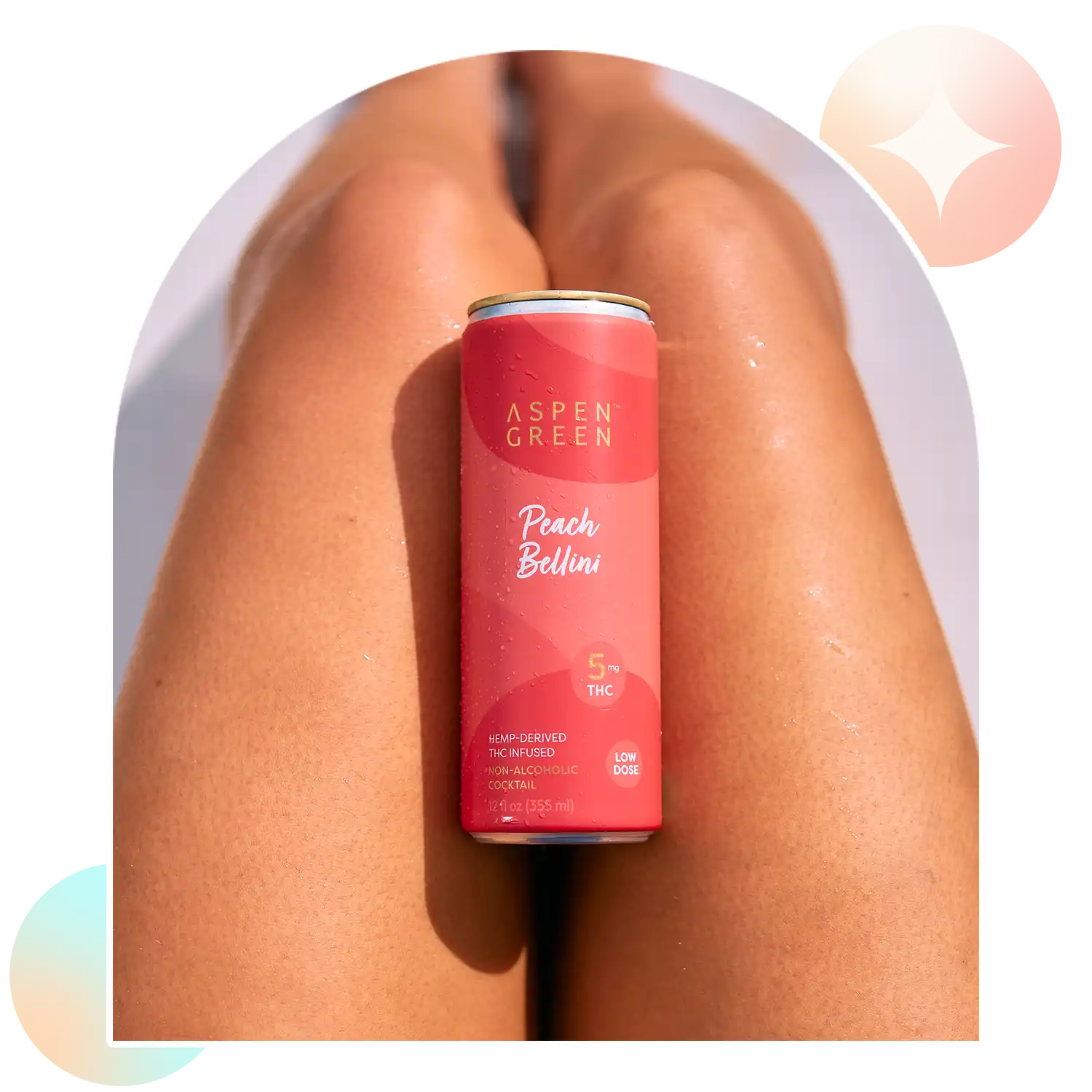 Aspen Green Peach Bellini 5mg THC beverage resting casually on a leg,