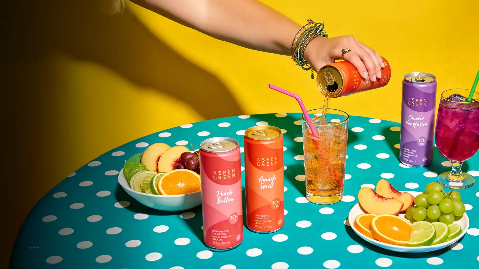 Aspen Green BOLO THC infused sparkling drinks displayed on a retro polka dot table.