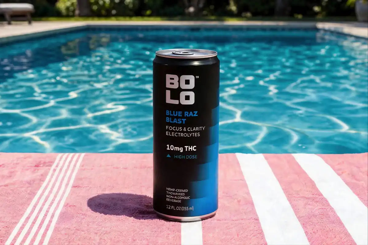 Bolo Blue Raz Blazing THC drink can by a poolside