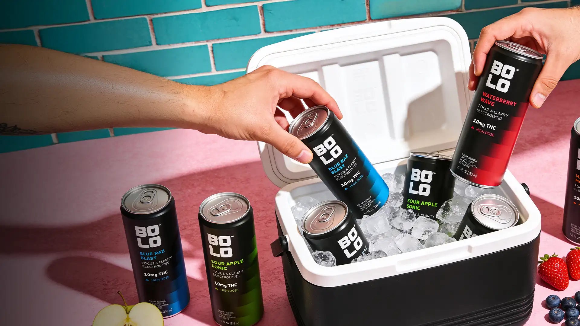 BOLO THC drinks chilling in an ice cooler as a hand reaches for one, showcasing refreshing cannabis infused sparkling beverages.