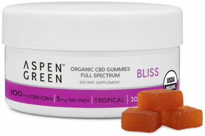Aspen Green Organic CBD Gummies - Bliss (100mg CBD+CBDV) Tropical Flavor Jar with Three Gummies Next to It
