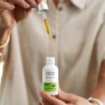 Suspended dropper of Aspen Green Extra Unflavored CBD Oil over tincture