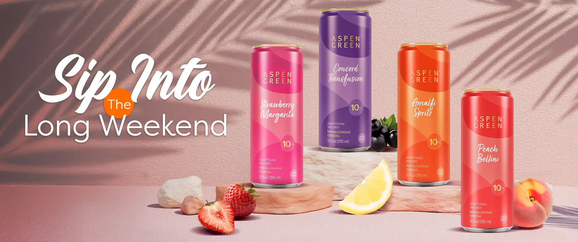 Four Aspen Green THC non-alcoholic cocktails surrounded by fresh fruit with banner title 'Sip into the Long Weekend'