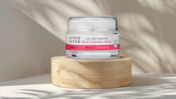 Aspen Green Relief Cooling Cream CBD Topical displayed on round wood pedestal